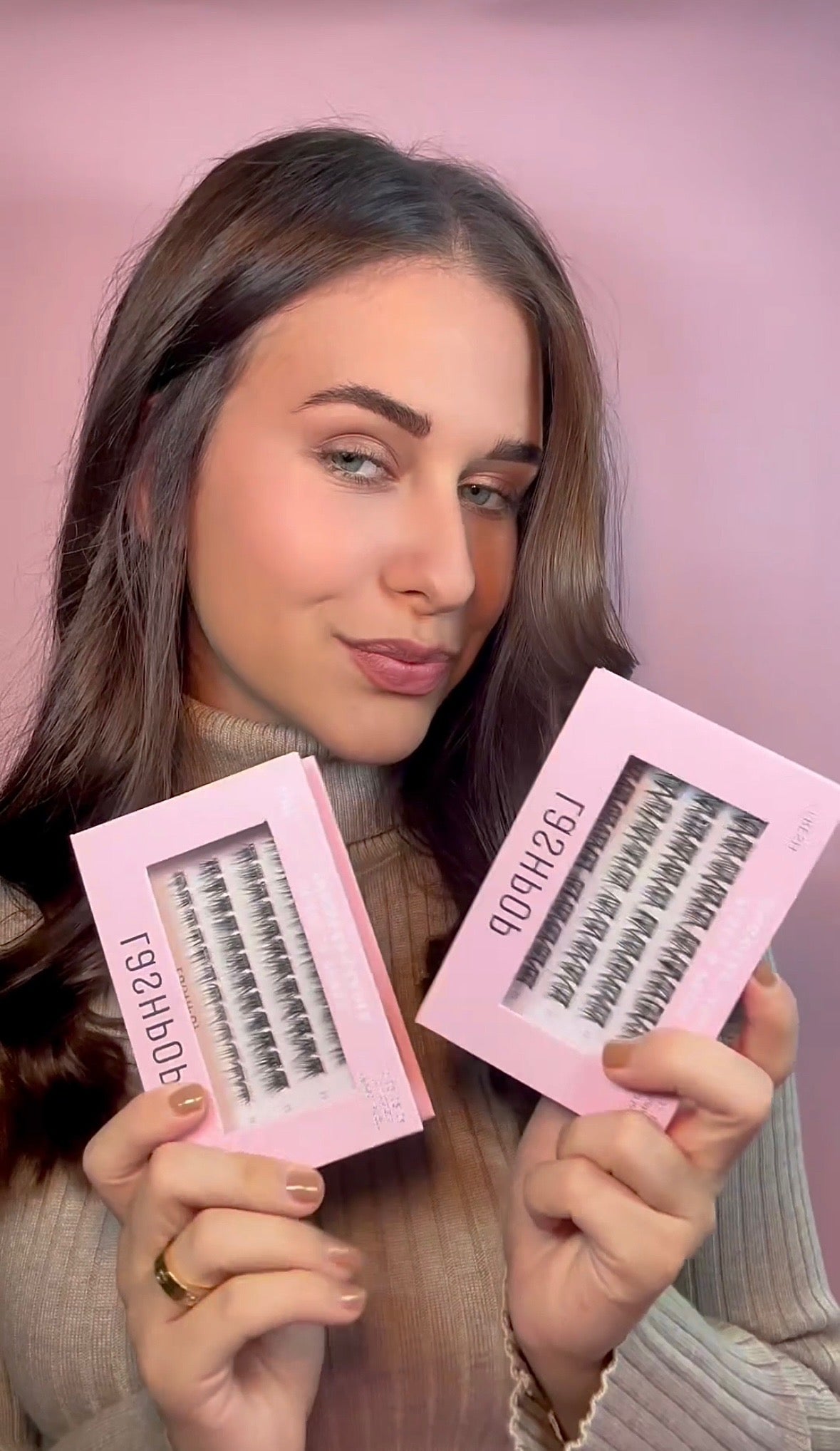 Load video: Video showing a customer applying Lashpop Place &amp; Press pre-glued lash clusters using our Lash Applicator - lashes are applied underneath the natural lash line for a seamless look.